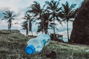Empty plastic bottle littered on the beach